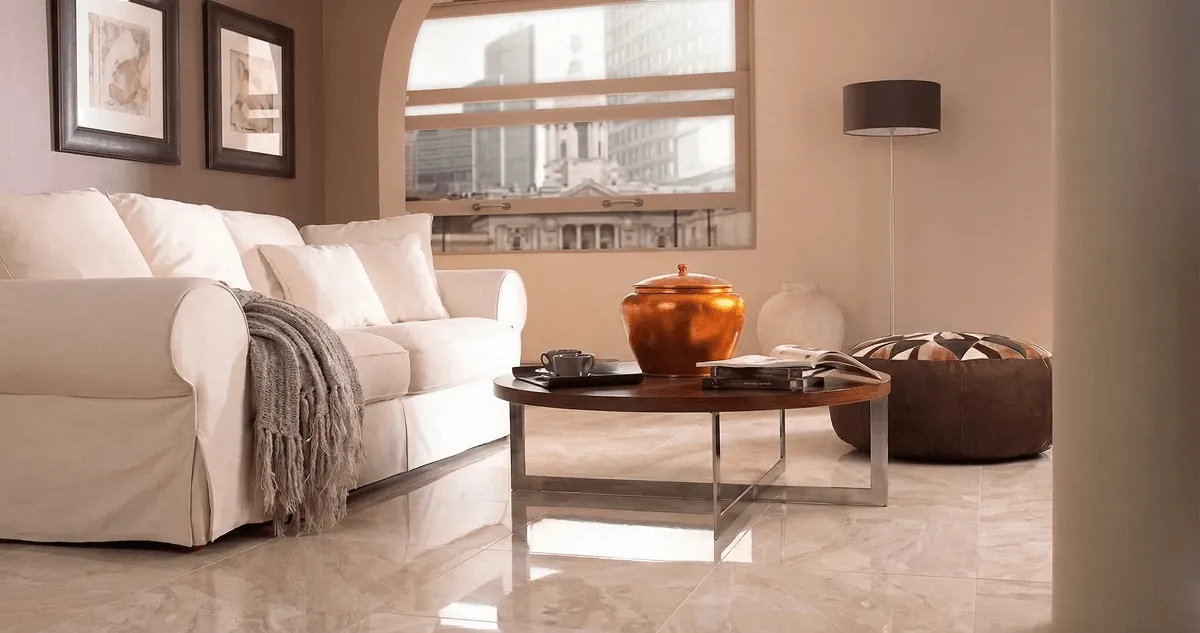Modern living room with professionally installed marble flooring, a beige sofa, coffee table in Jersey City, NJ