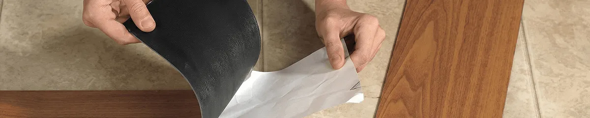 A professional installing vinyl flooring in Jersey City, NJ